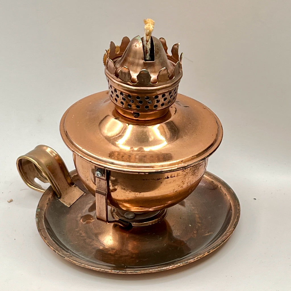 A vintage copper miniature chamber oil lamp featuring a round dish saucer base with a finger loop handle and a crown burner gallery with cotton wick. - Photo 3