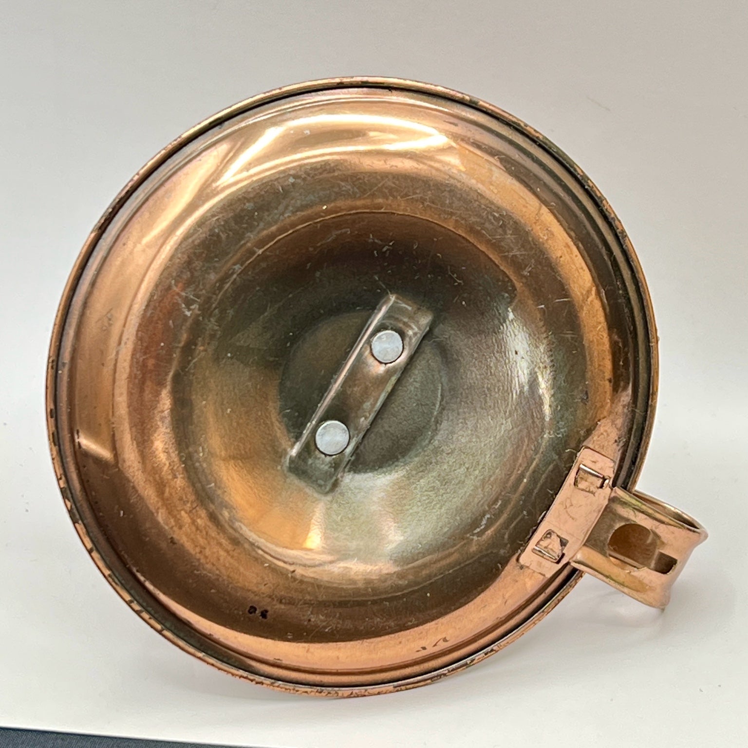 A vintage copper miniature chamber oil lamp featuring a round dish saucer base with a finger loop handle and a crown burner gallery with cotton wick. - Photo 6