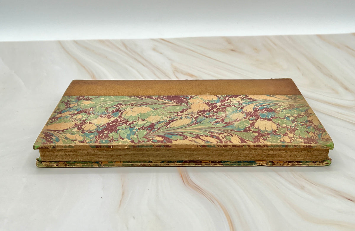 Antique leather bound volume with tan leather spine, raised ribs, and vibrant green, plum, and cream peacock combed marbled paper over hard boards. - Photo 3