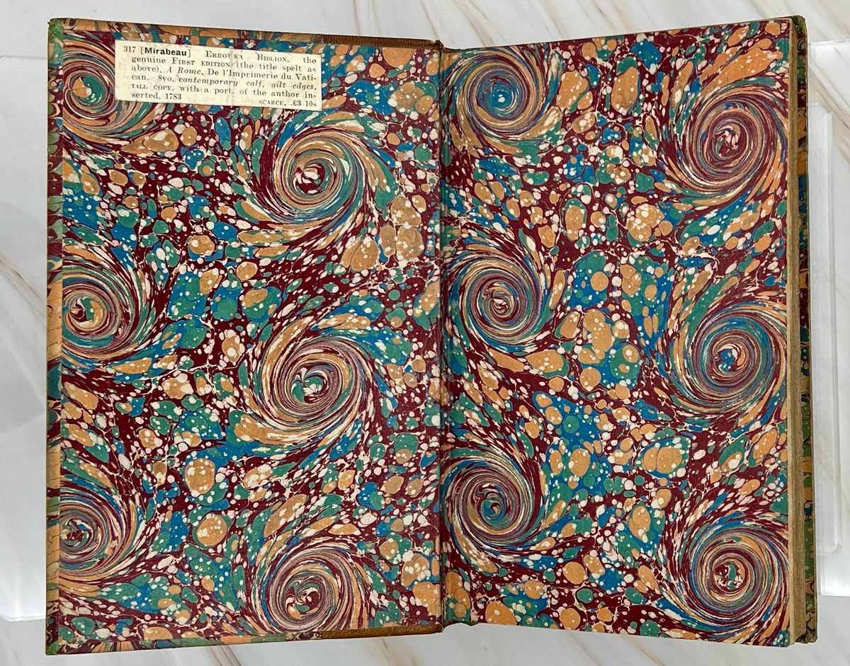 Antique leather bound volume with tan leather spine, raised ribs, and vibrant green, plum, and cream peacock combed marbled paper over hard boards. - Photo 4