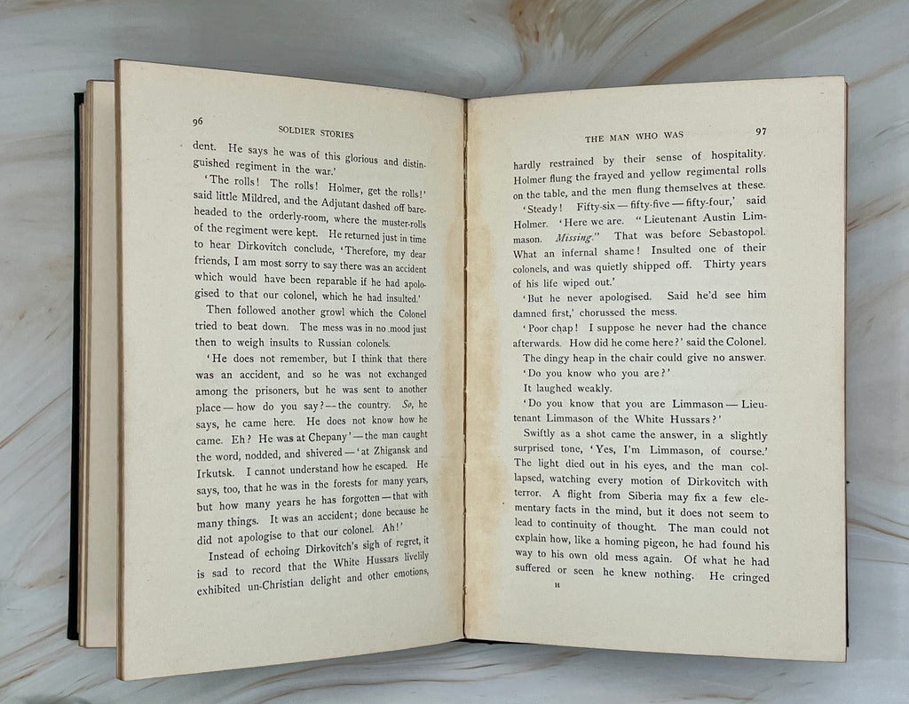 Dark green cloth hardcover book titled Soldier Stories by Rudyard Kipling featuring elaborate gilt embossed lettering, framed story titles, and wildlife illustrations. - Photo 9