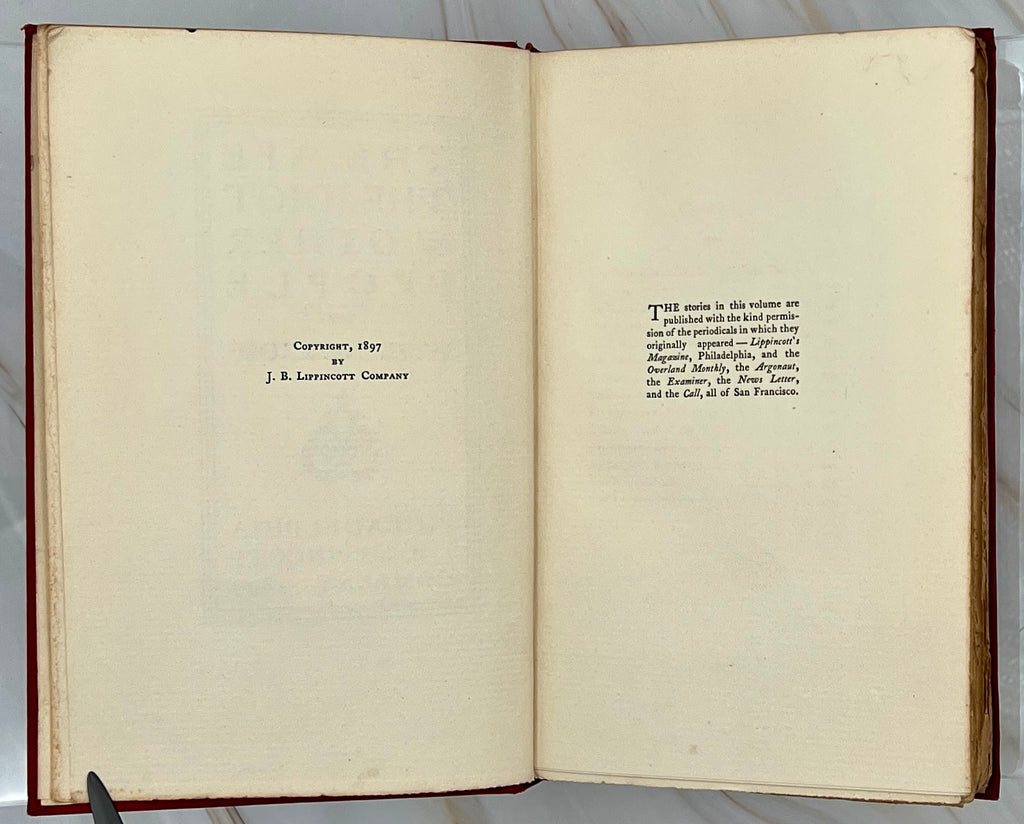 Antique red cloth hardcover book titled The Ape, the Idiot & Other People by W. C. Morrow, featuring an ornate gilt-stamped mythical dragon and gold lettering. - Photo 6
