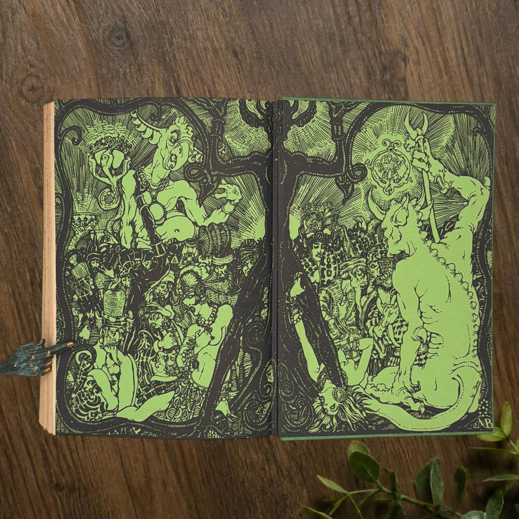 Front cover of the 1928 hardcover edition of Vathek bound in textured green book cloth, resting upright on a dark natural wood surface. - Photo 12