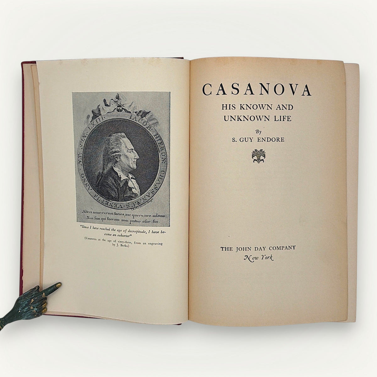 Red cloth hardcover edition of Casanova: His Known and Unknown Life, displayed flat showing the woven textile texture and vertical book cloth grain. - Photo 5