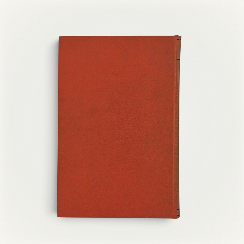 Burnt orange cloth hardcover book standing upright against a neutral background, featuring a minimalist textured cloth front board with black stamped linear accents along the spine edge. - Photo 9