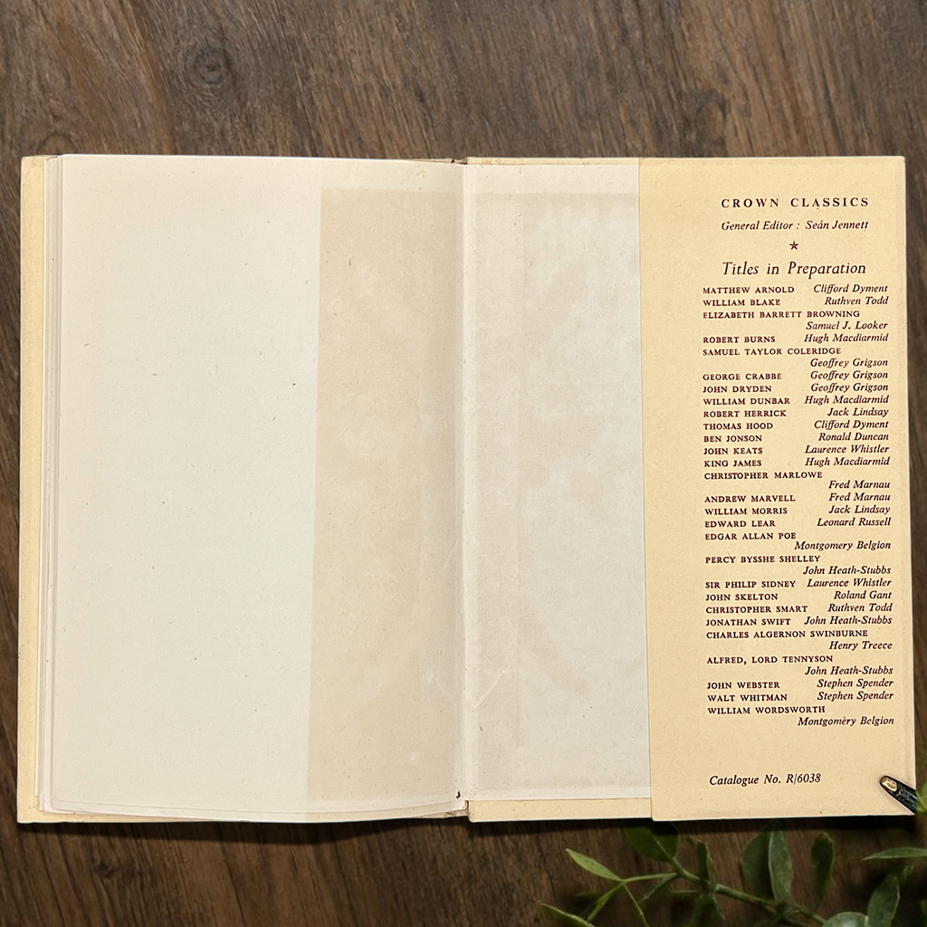 An open vintage Crown Classics edition of Christopher Smart's poem A Song to David, showing printed stanzas across cream paper pages on a rustic wooden table. - Photo 7
