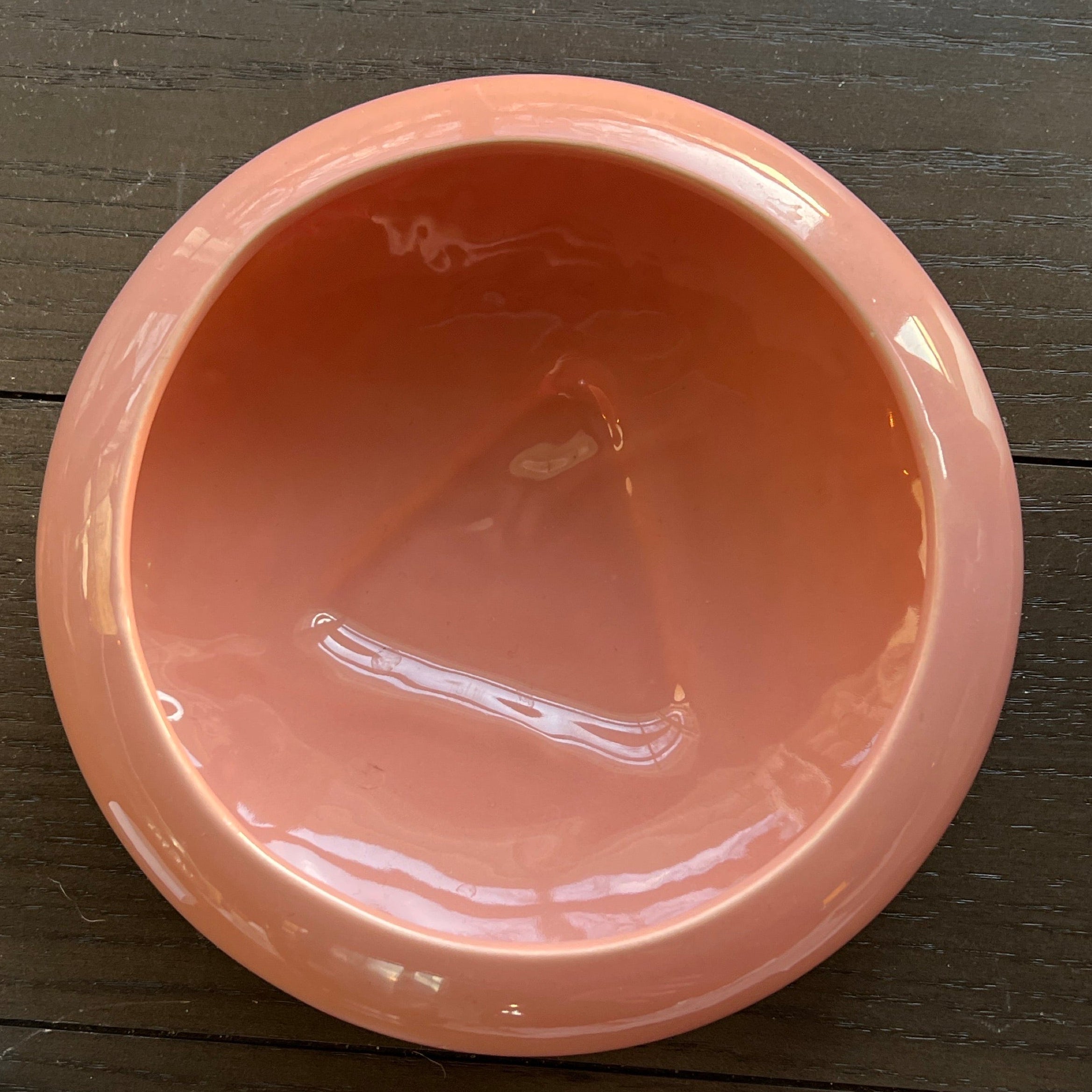 Mid-century Haeger H8443 pink tri-footed planter bowl with a low rounded profile