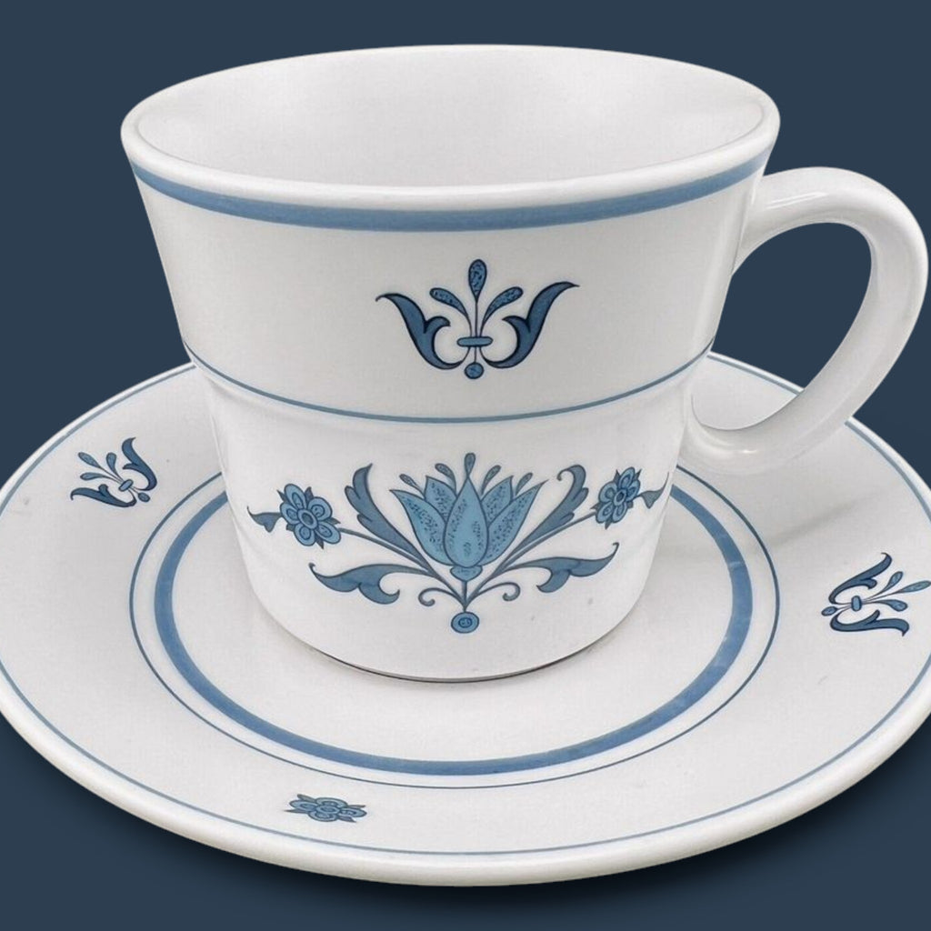 Vintage Noritake Progression Blue Haven cup and saucer set featuring a slate blue mid-century modern floral pattern. - Photo 1