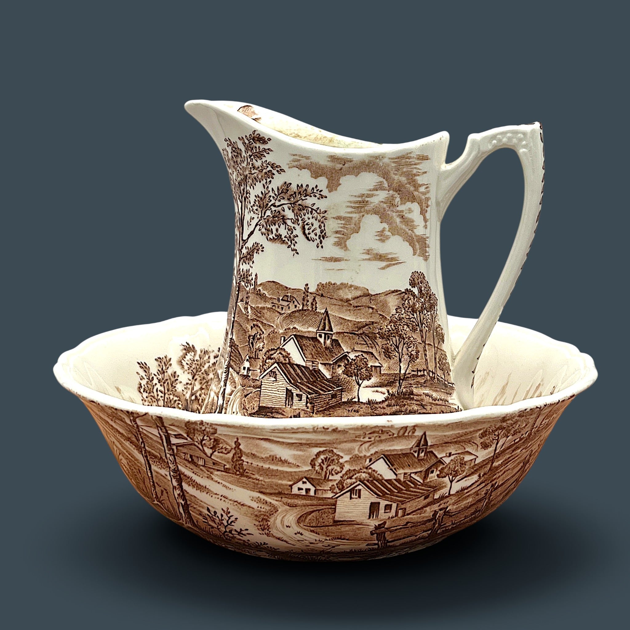 An antique Alfred Meakin brown transferware ceramic pitcher decorated with a detailed countryside landscape and leafy handle motif. - Photo 1