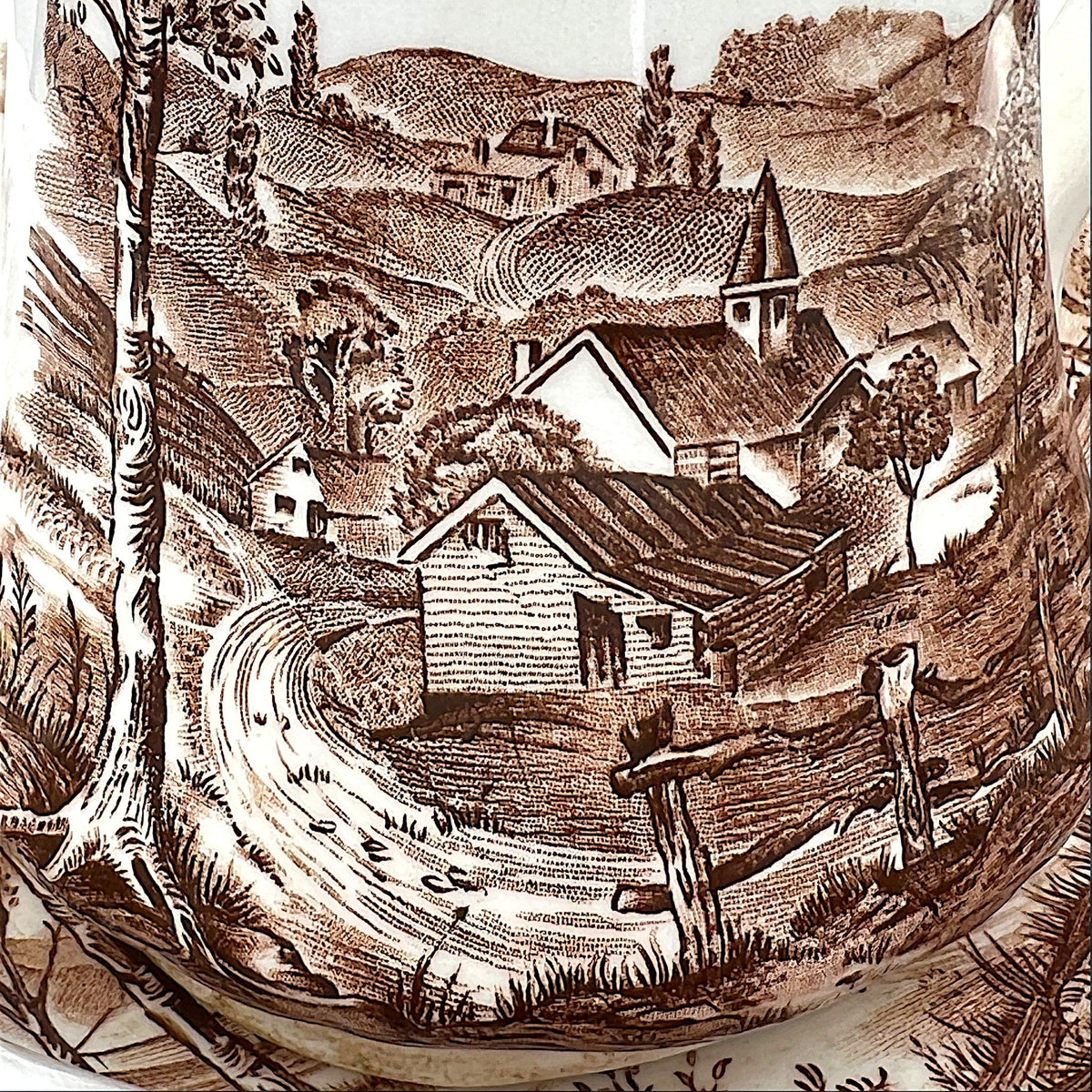 An antique Alfred Meakin brown transferware ceramic pitcher decorated with a detailed countryside landscape and leafy handle motif. - Photo 6