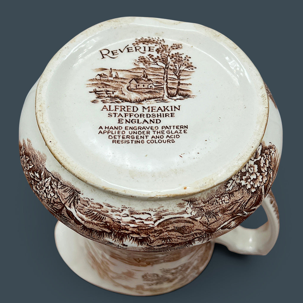 An antique Alfred Meakin brown transferware ceramic pitcher decorated with a detailed countryside landscape and leafy handle motif. - Photo 11