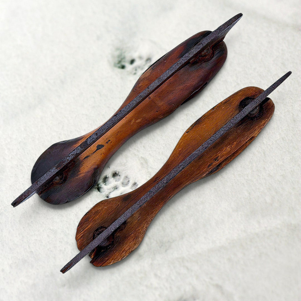 Pair of antique 19th-century hand-carved wood and wrought iron ice skates crossed on snow. - Photo 8
