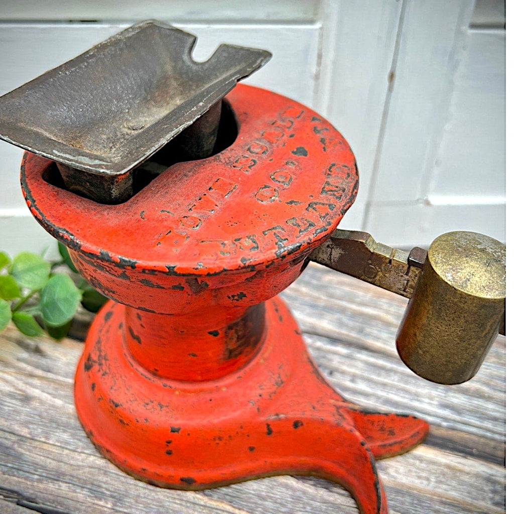 An antique Howe Scale Co. counterbalance scale with a red painted cast iron base and a graduated brass beam holding a solid cylindrical brass slider weight. - Photo 2