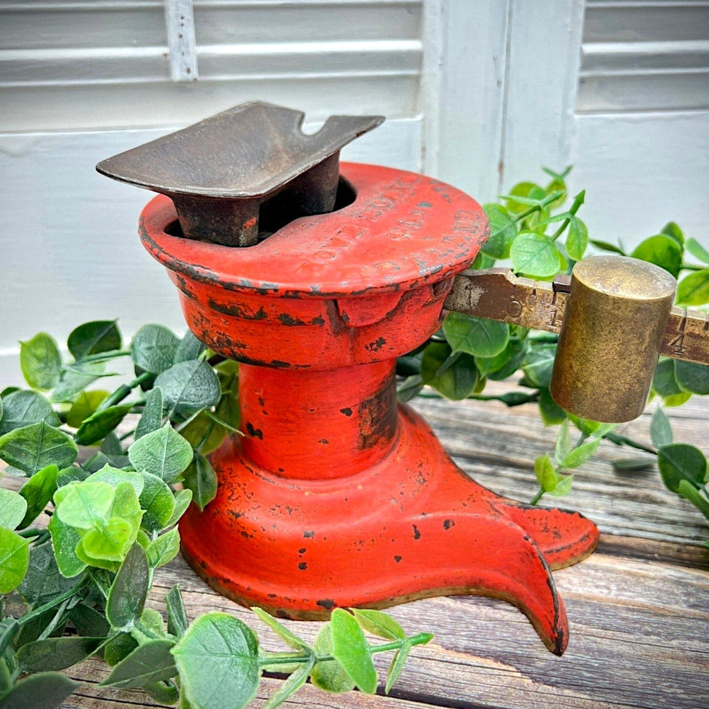 An antique Howe Scale Co. counterbalance scale with a red painted cast iron base and a graduated brass beam holding a solid cylindrical brass slider weight. - Photo 3