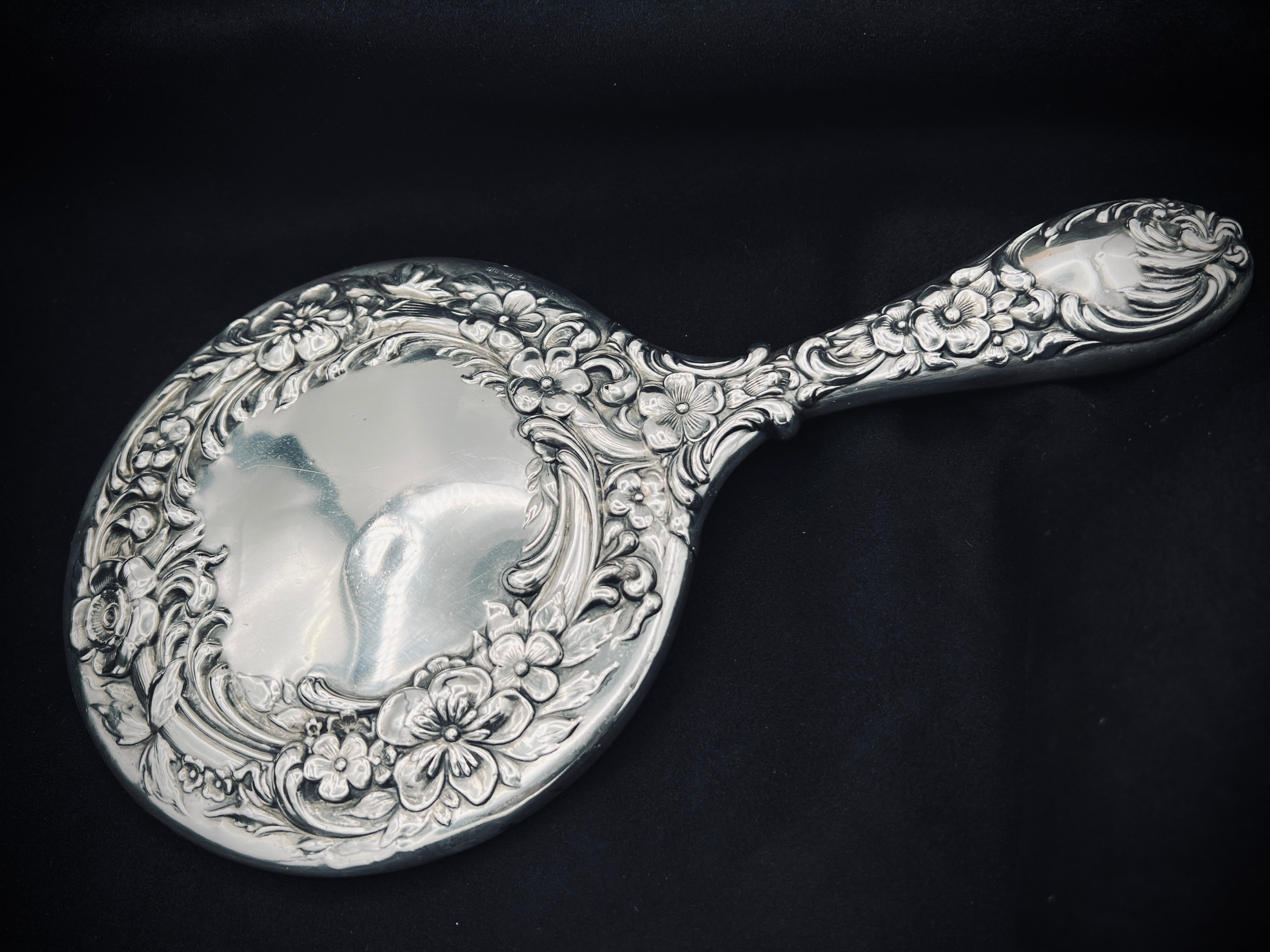 Antique Sterling Silver Handheld Mirror with Ornate Floral Design