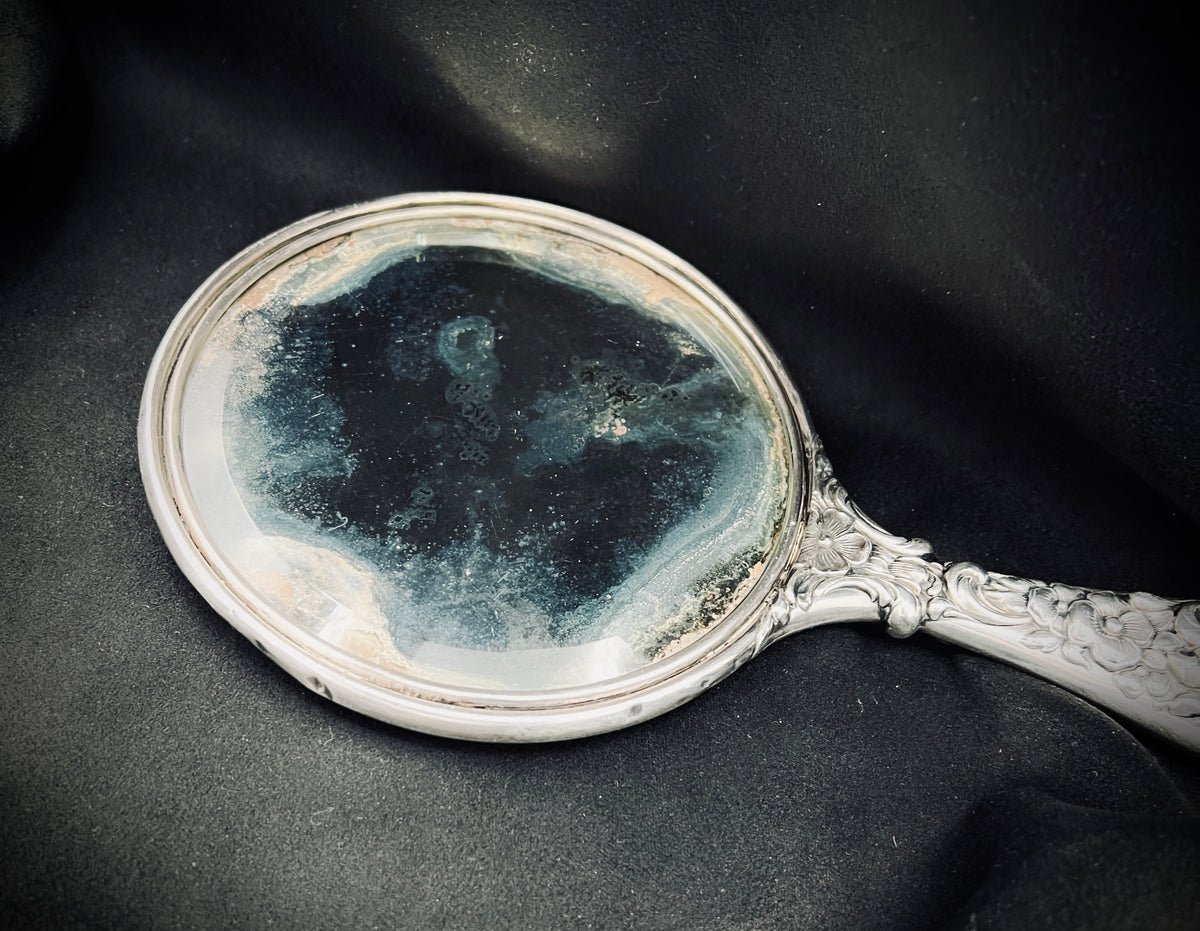 Antique Sterling Silver Handheld Mirror with Ornate Floral Design