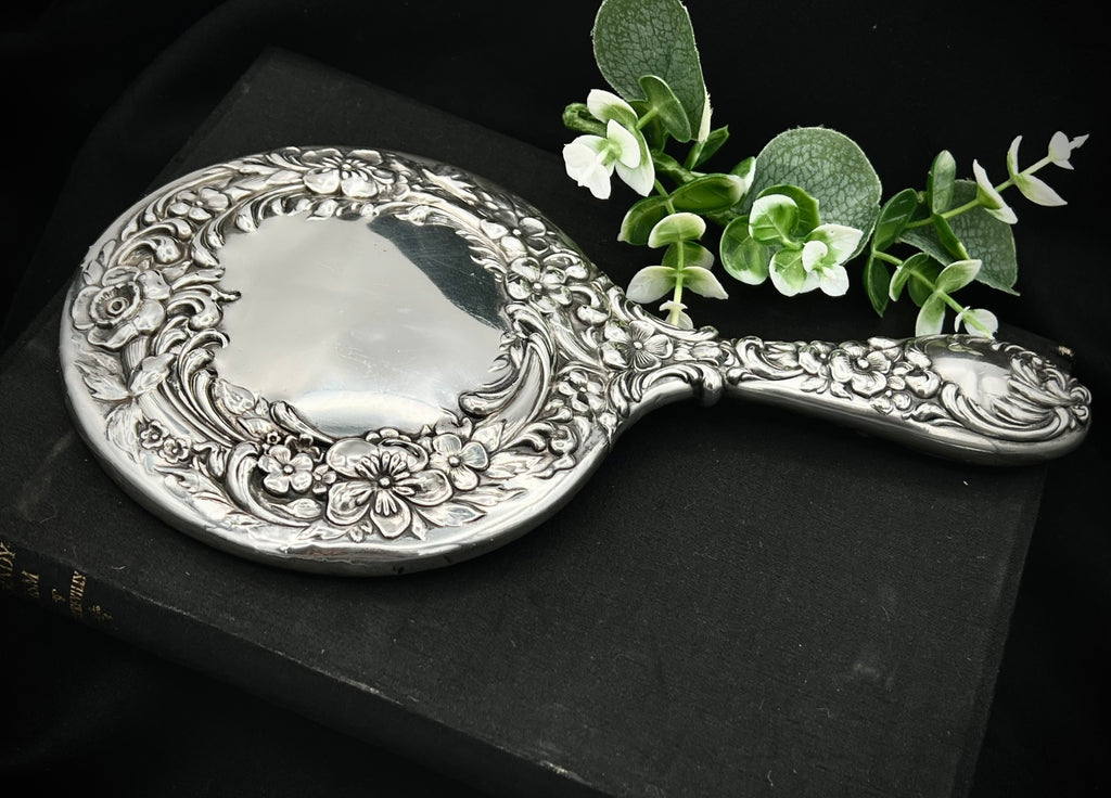 Antique Sterling Silver Handheld Mirror with Ornate Floral Design