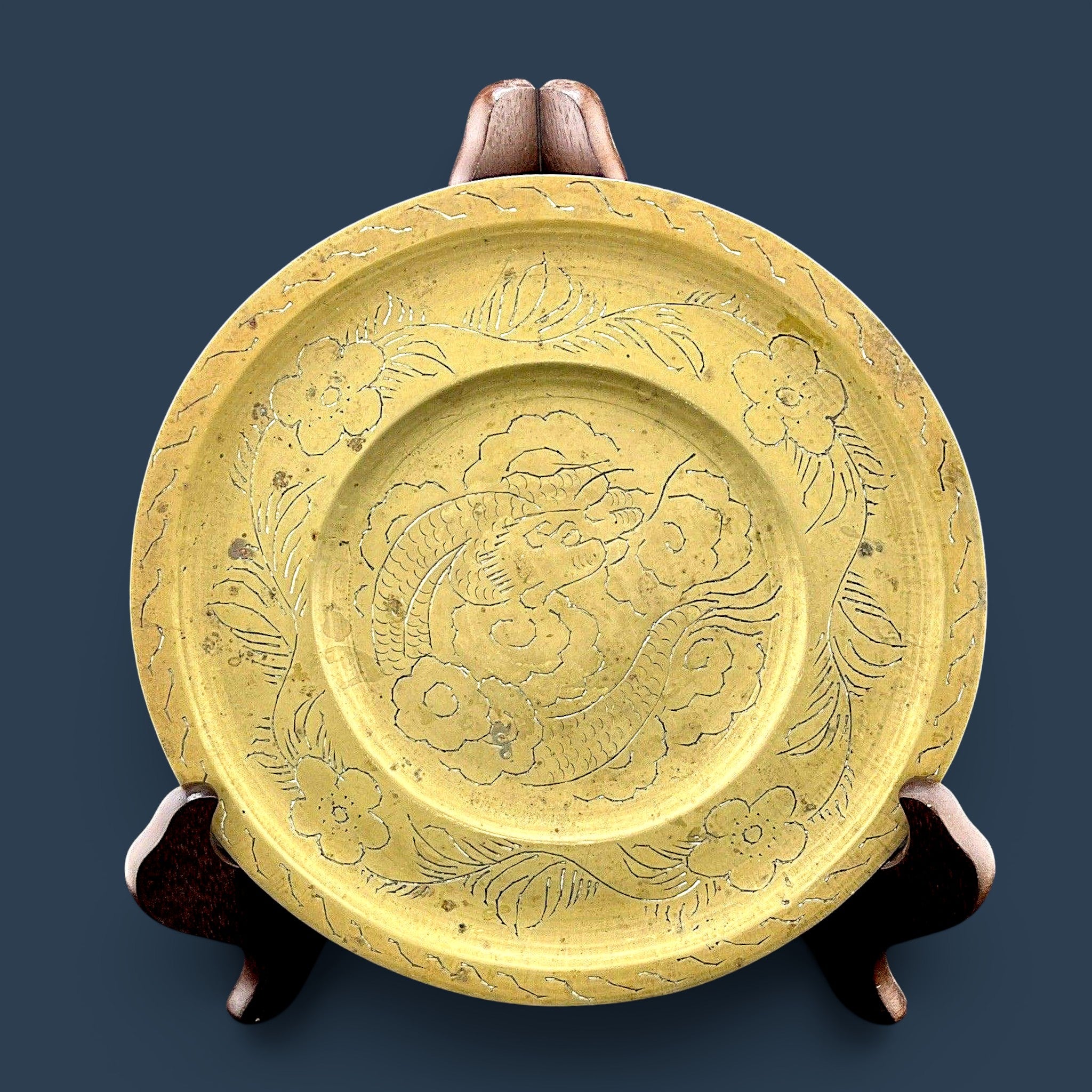 Antique Chinese hand-engraved brass plate featuring a celestial dragon and plum blossom border. - Photo 1