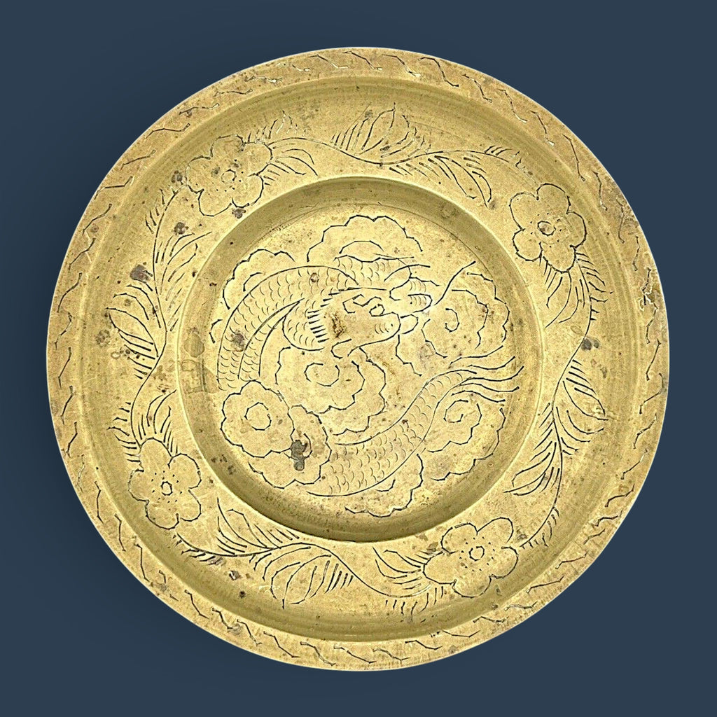 Antique Chinese hand-engraved brass plate featuring a celestial dragon and plum blossom border. - Photo 2