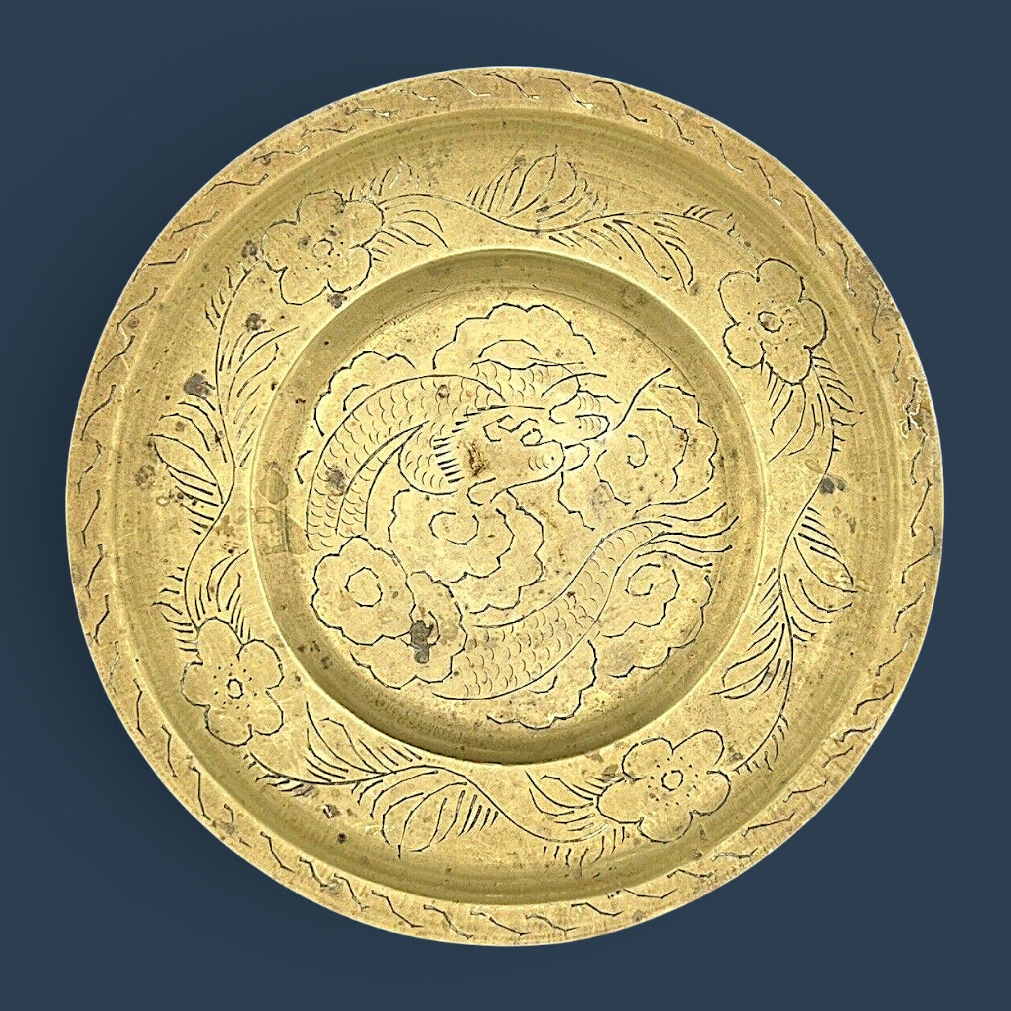 Antique Chinese hand-engraved brass plate featuring a celestial dragon and plum blossom border. - Photo 2