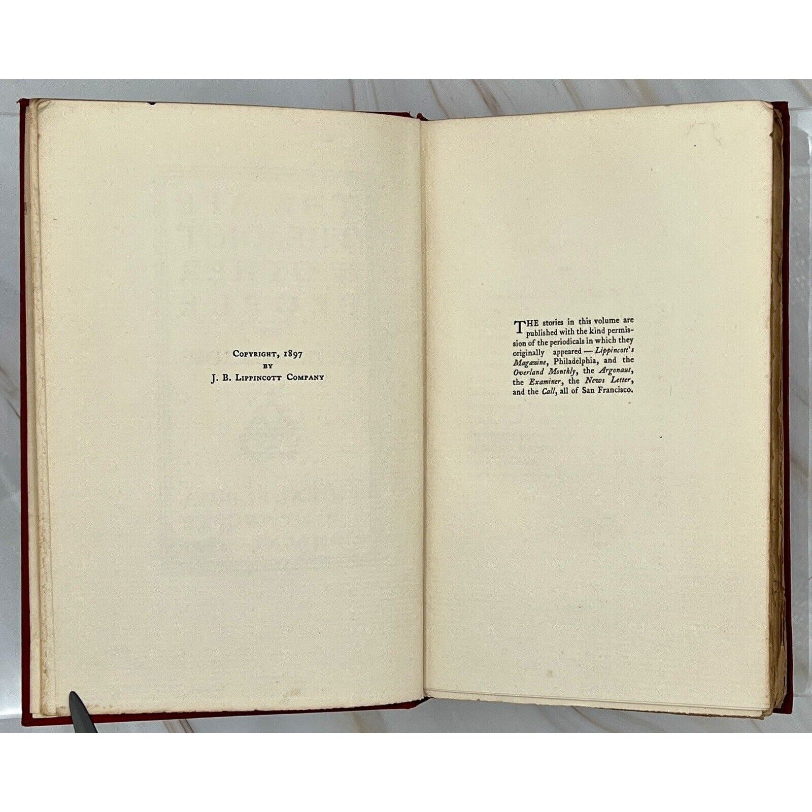 Open first edition 1897 Gothic horror The Ape, The Idiot & Other People by W.C. Morrow; copyright pages shown.