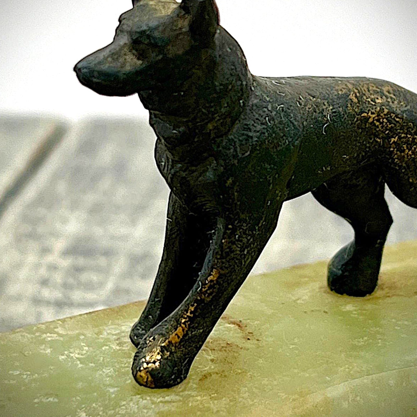 An Art Deco green onyx trinket dish featuring a detailed dark patinated metal figurine of a standing German Shepherd dog mounted on the corner of the polished translucent green stone base. - Photo 5