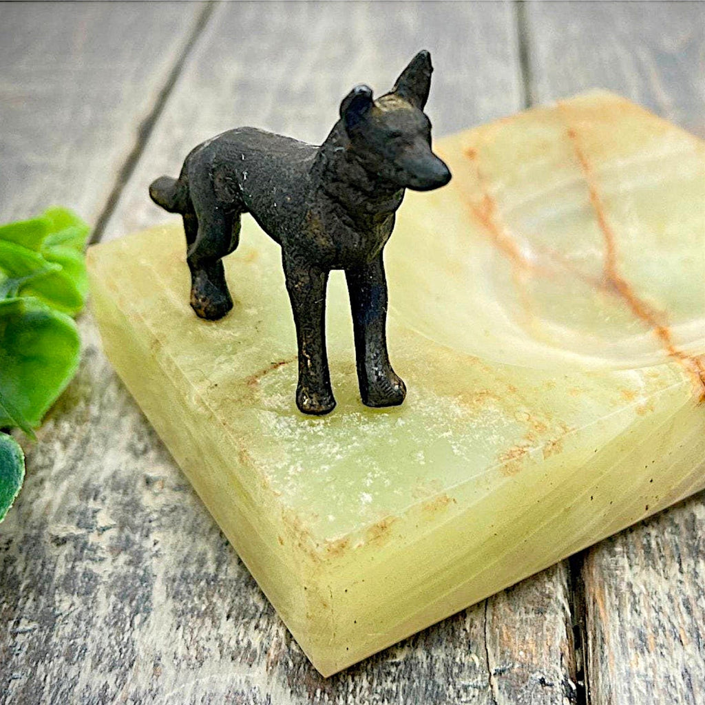 An Art Deco green onyx trinket dish featuring a detailed dark patinated metal figurine of a standing German Shepherd dog mounted on the corner of the polished translucent green stone base. - Photo 8