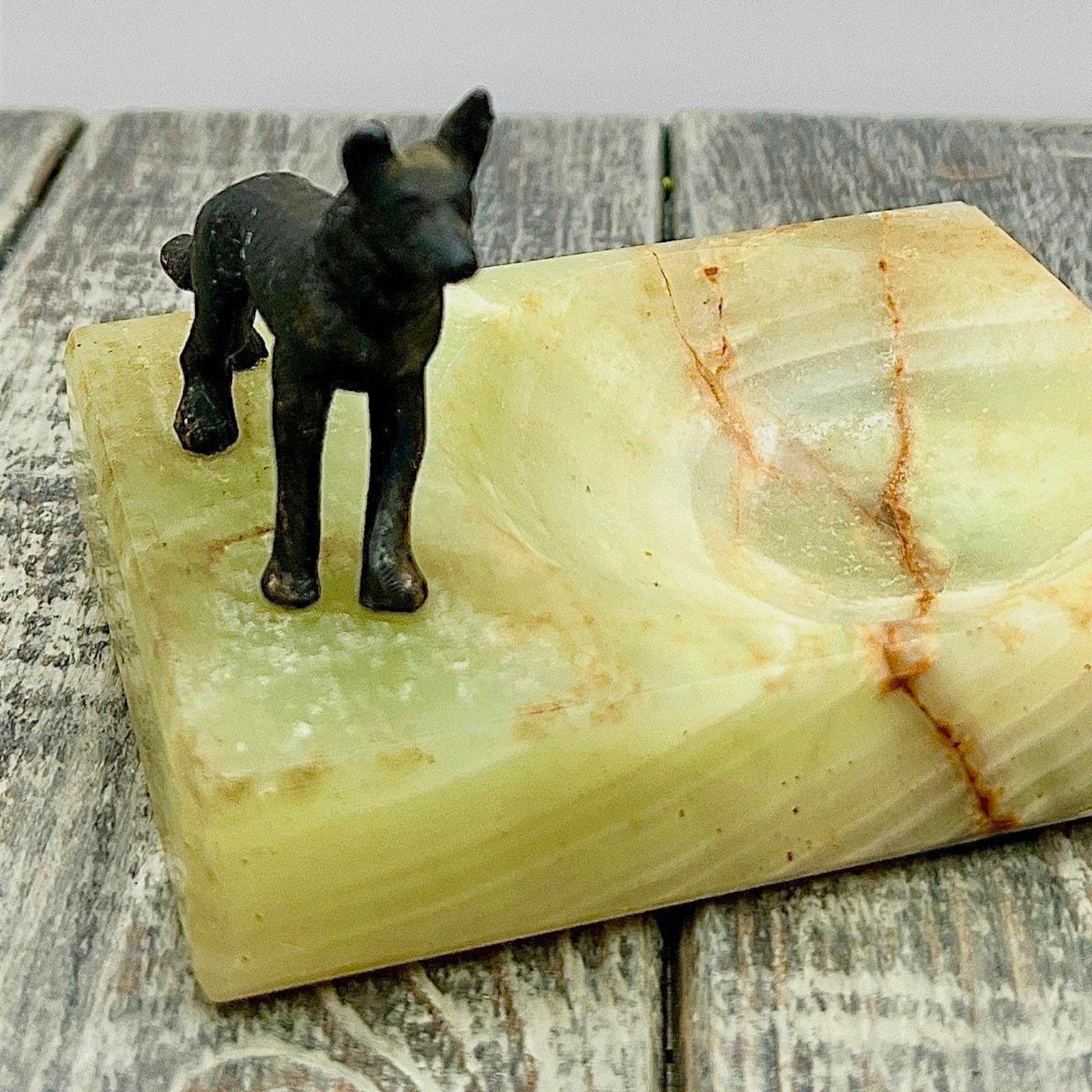 An Art Deco green onyx trinket dish featuring a detailed dark patinated metal figurine of a standing German Shepherd dog mounted on the corner of the polished translucent green stone base. - Photo 9