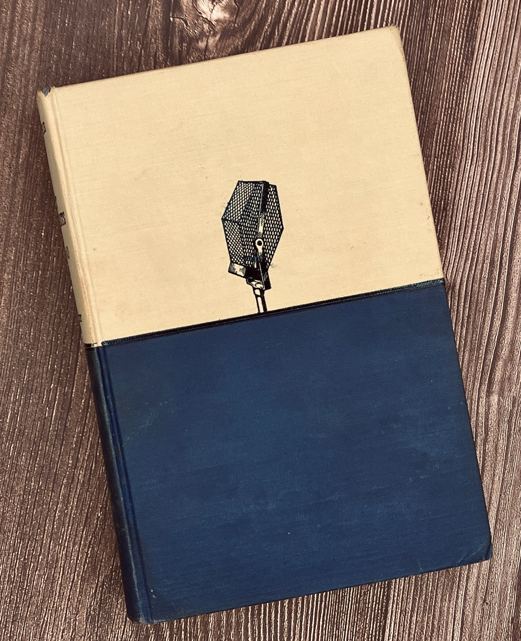 Hardcover book Best Broadcasts of 1939-40 featuring a two-tone cloth binding with an off-white upper half depicting a black line art radio microphone above a solid navy blue lower cloth cover. - Photo 2