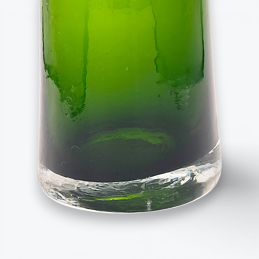 A tall, tapered mid-century green glass decanter with a flared rim and cork stopper, standing against a clean white background. - Photo 5