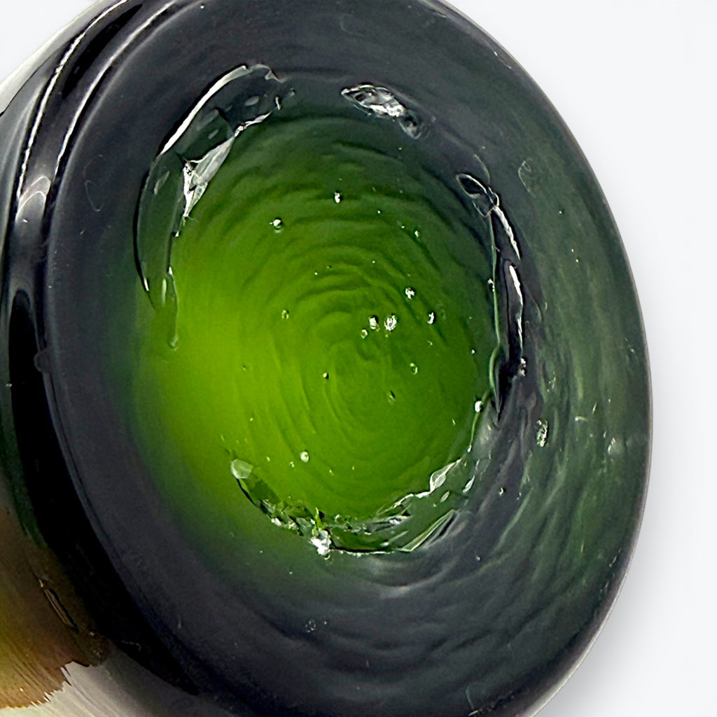 A tall, tapered mid-century green glass decanter with a flared rim and cork stopper, standing against a clean white background. - Photo 7
