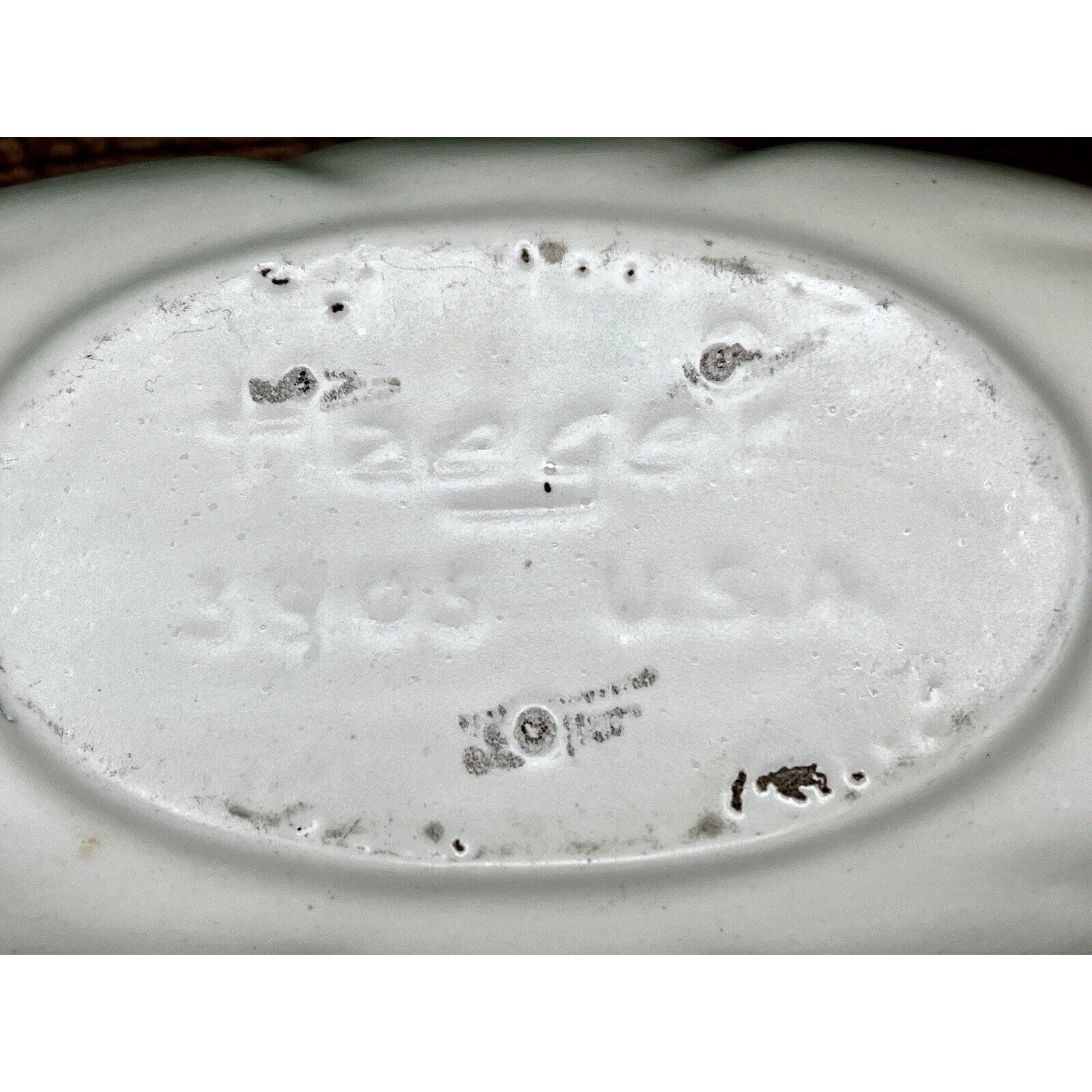 Underside of white Haeger 3905 oblong ceramic bowl with impressed backstamp.