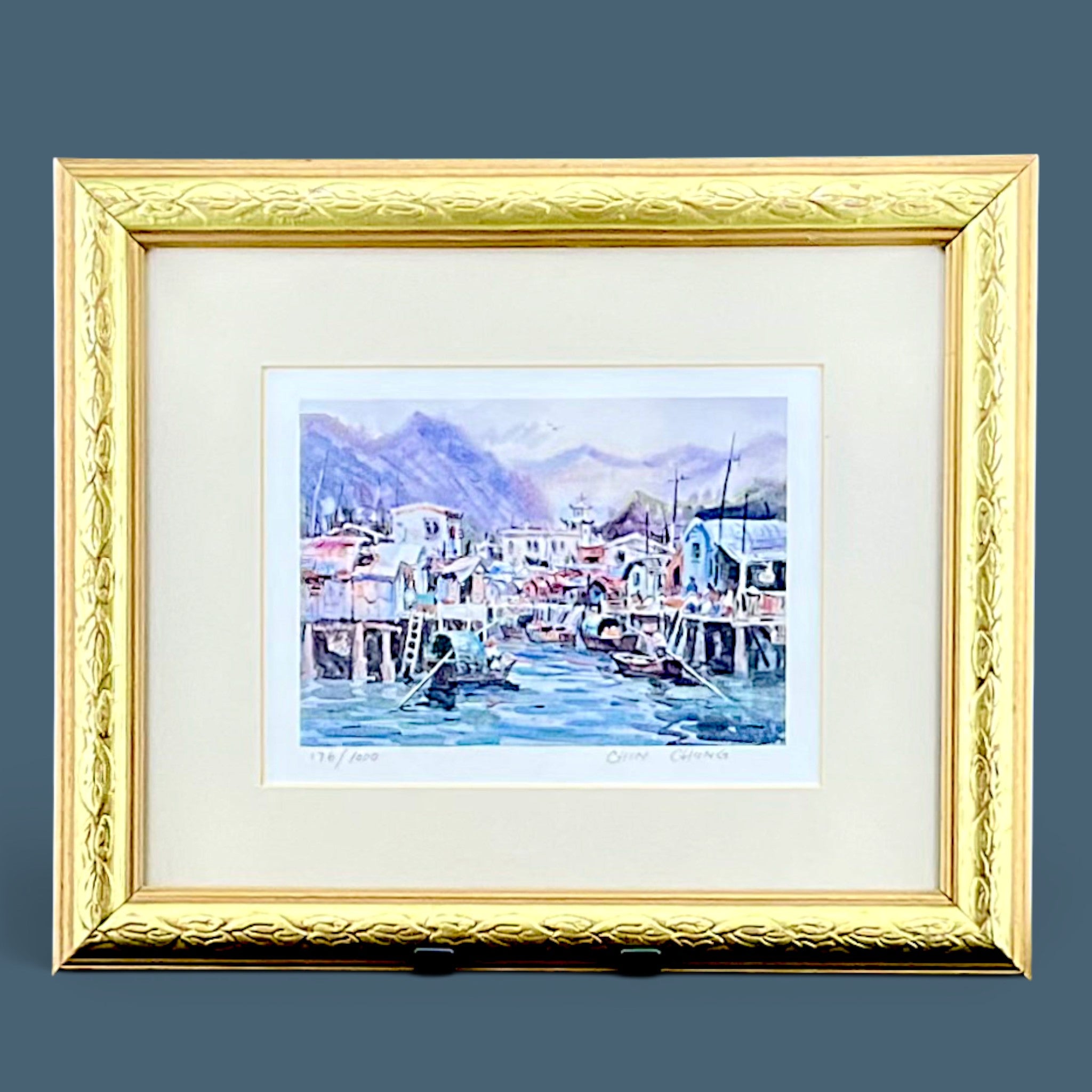 Framed and matted limited edition print by Chin Chung showing a watercolor style harbor scene with stilt houses. - Photo 1