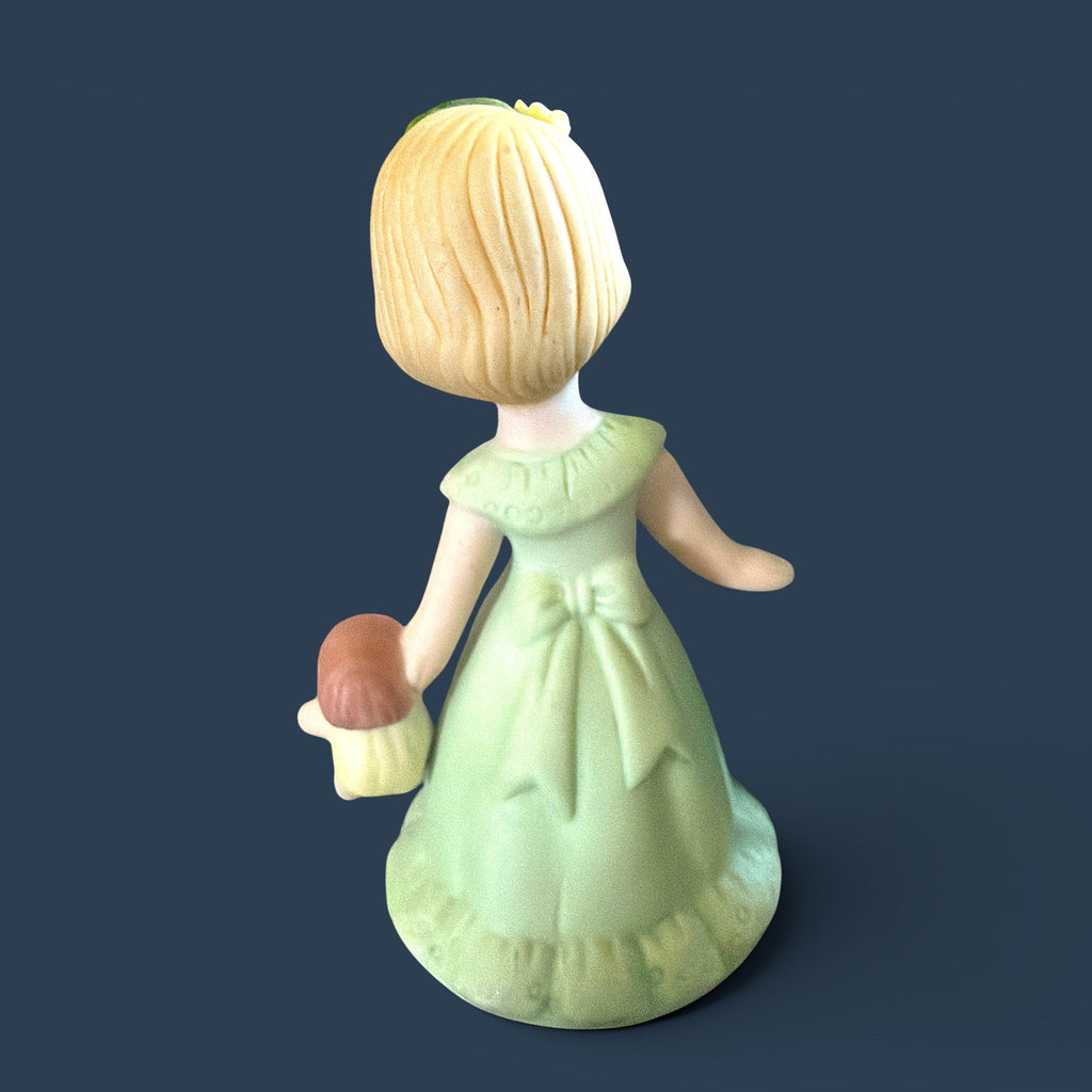Vintage Enesco Growing Up Girls Age 3 porcelain figurine showing a blonde girl holds her favorite yellow-dressed doll in one hand, while her other hand is elegantly extended. - Photo 2