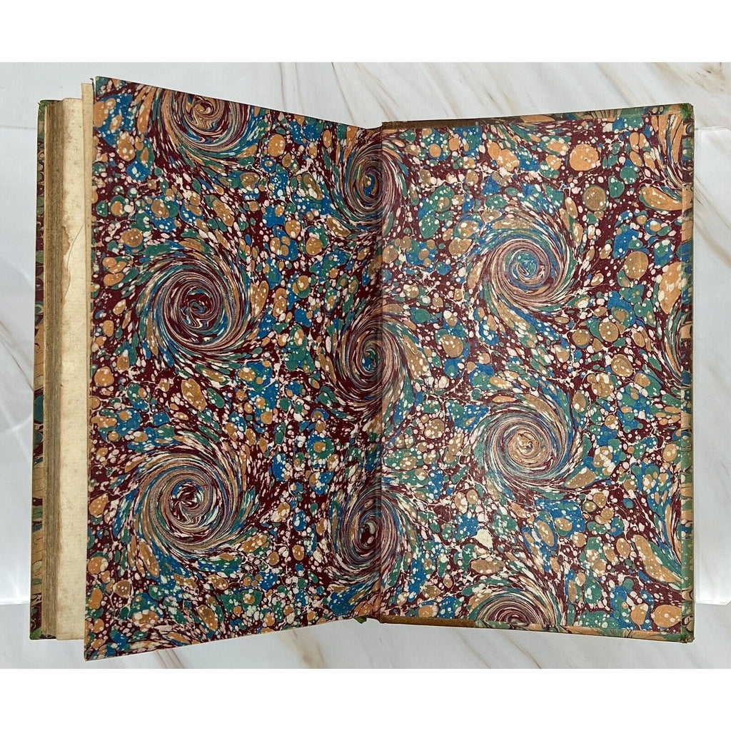 Colorful marbled endpapers from Errotika Biblion by de Mirabeau, 1783 first edition, leather-bound antique book.