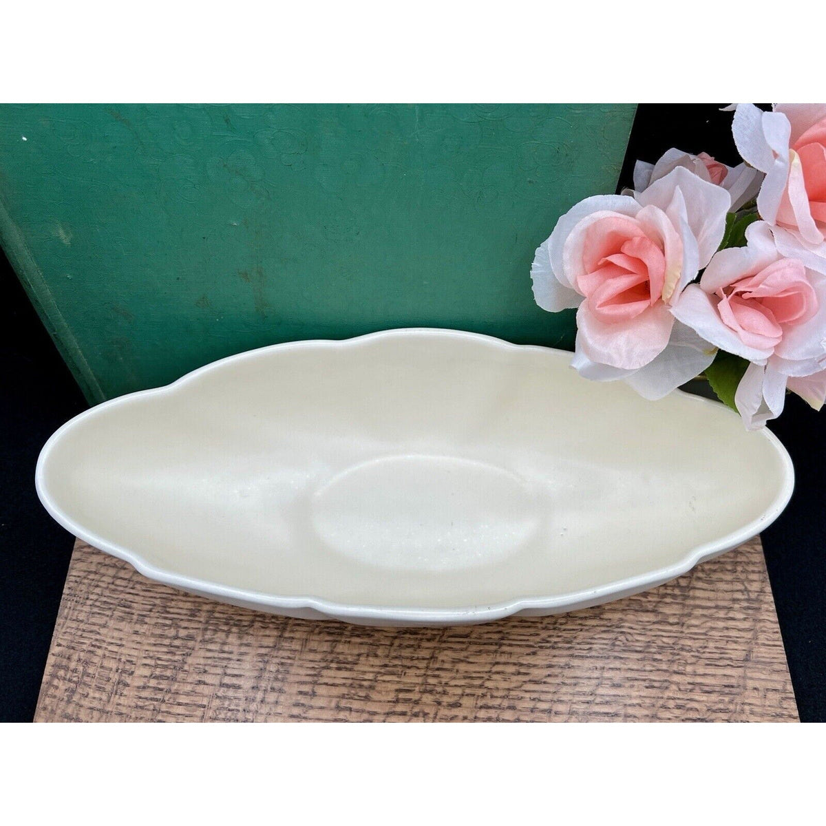 Vintage Haeger ceramic console bowl and planter in soft white glaze, featuring an elongated boat-like form with gentle scalloped ridges along the perimeter, displayed on a rustic wood surface in front of book and floral accents. - Photo 2