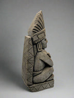 Stone status with geometric patterns on a white background