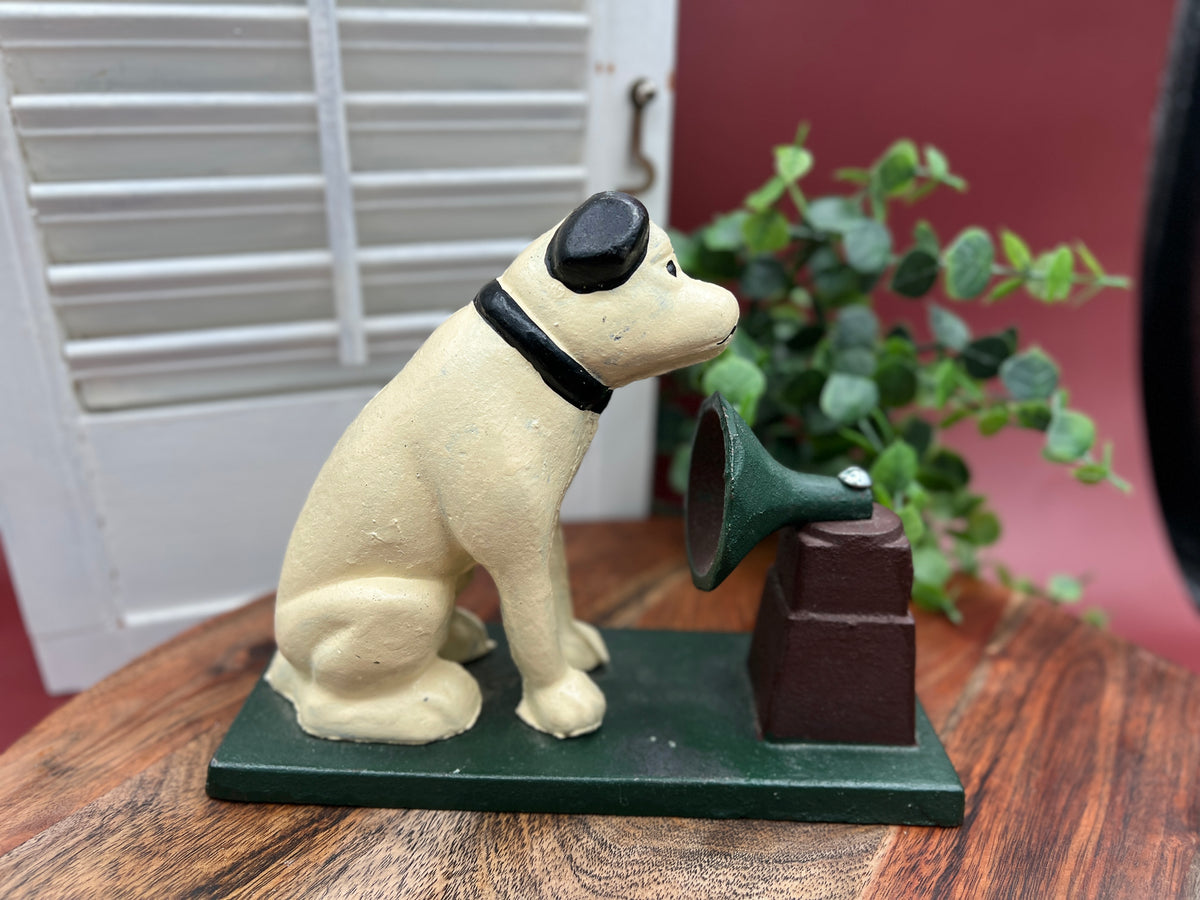 A heavy cast iron coin bank depicting the RCA Victor terrier dog sitting attentively next to a gramophone horn on a rectangular green painted base. - Photo 2