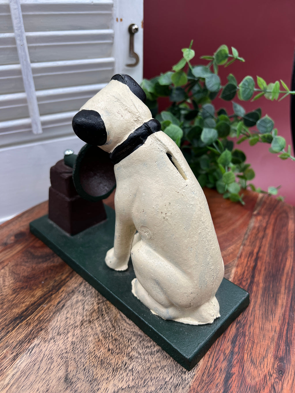 A heavy cast iron coin bank depicting the RCA Victor terrier dog sitting attentively next to a gramophone horn on a rectangular green painted base. - Photo 3