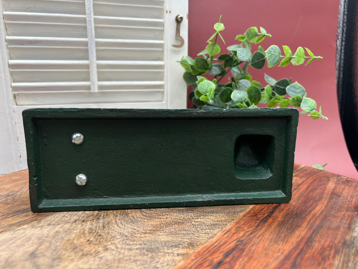 A heavy cast iron coin bank depicting the RCA Victor terrier dog sitting attentively next to a gramophone horn on a rectangular green painted base. - Photo 5