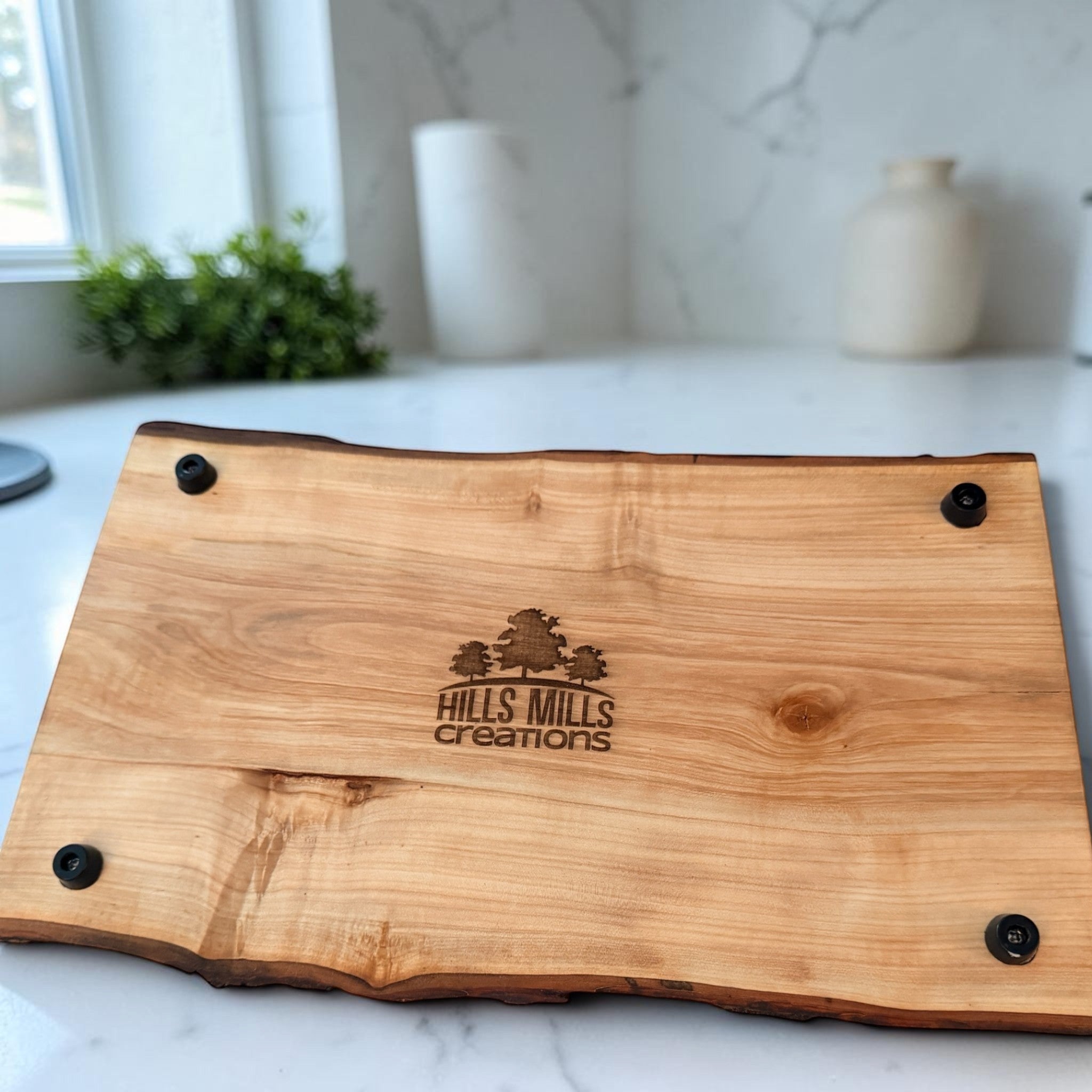Patina & Prose handmade live edge cherry wood serving tray with bark edge and black feet. 13.5-inch.