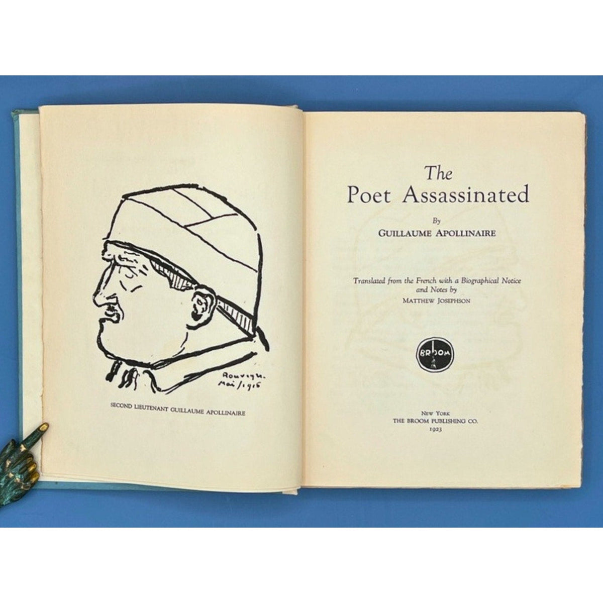 An open 1923 limited edition book displaying the title page of The Poet Assassinated by Guillaume Apollinaire and an opposing line-drawing portrait illustration of Second Lieutenant Guillaume Apollinaire. - Photo 4