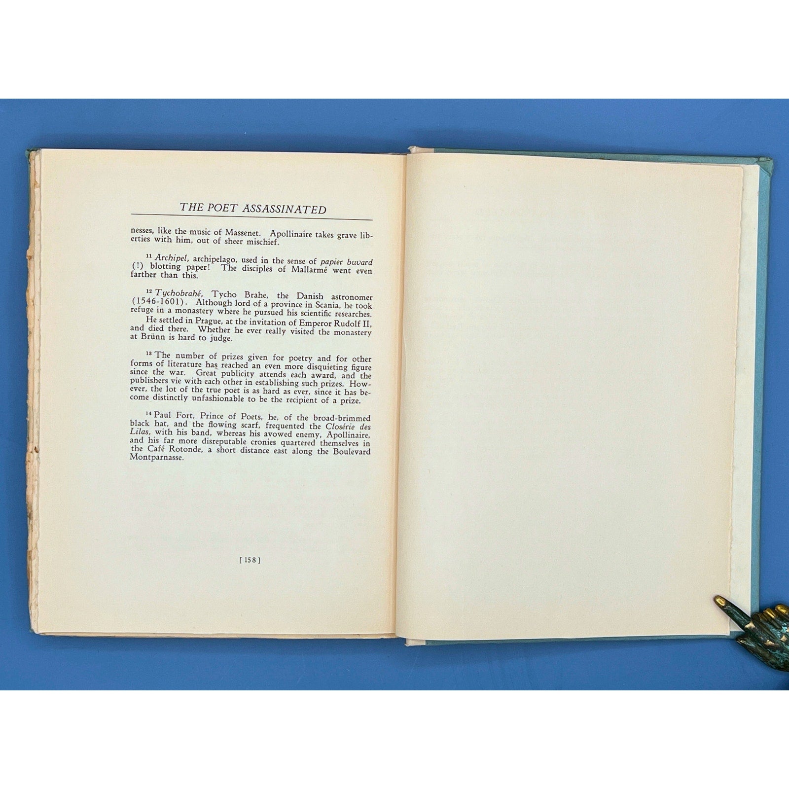 An open 1923 limited edition book displaying the title page of The Poet Assassinated by Guillaume Apollinaire and an opposing line-drawing portrait illustration of Second Lieutenant Guillaume Apollinaire. - Photo 6
