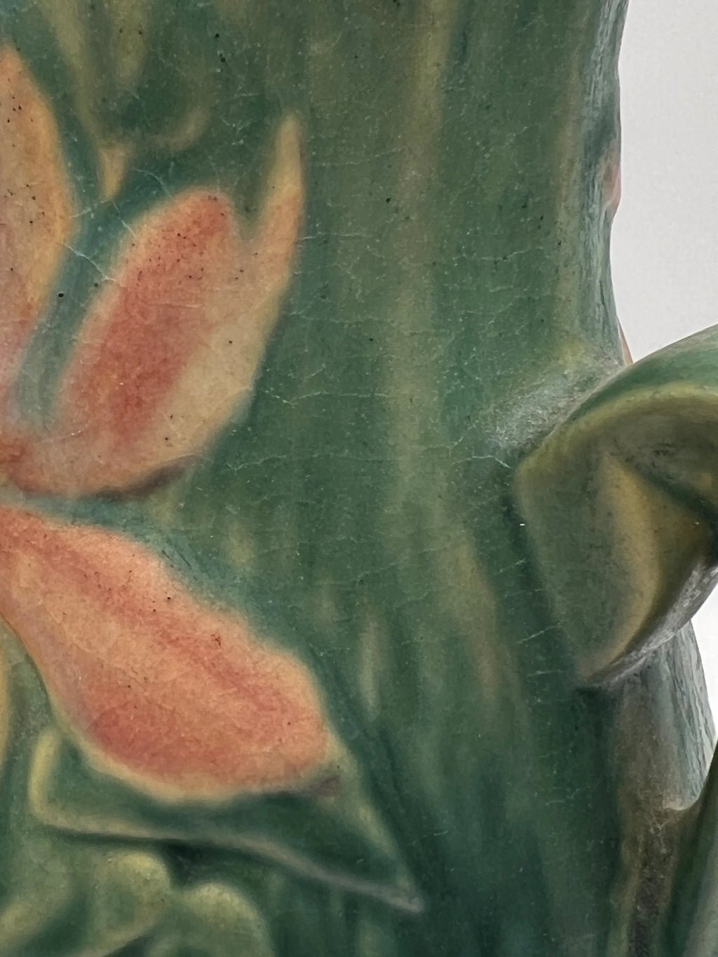 Vintage Roseville Clematis art pottery vase featuring an earthy green textured ground, sculpted angular side handles, and an embossed peach clematis bloom with a yellow center. - Photo 5
