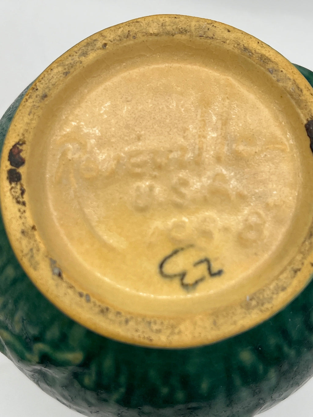 Vintage Roseville Clematis art pottery vase featuring an earthy green textured ground, sculpted angular side handles, and an embossed peach clematis bloom with a yellow center. - Photo 7