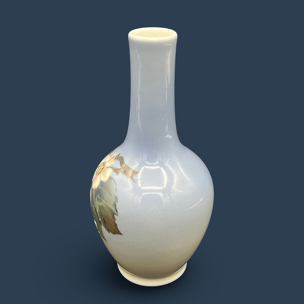 A Royal Copenhagen porcelain bud vase featuring a bulbous body, a slender elongated neck, and a glossy white glaze that fades into a soft cream and pale blue-gray gradient at the base. - Photo 2
