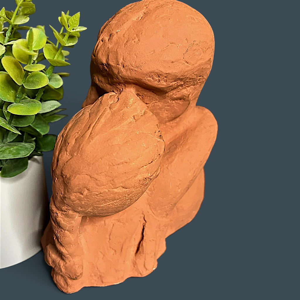 Terracotta clay sculpture depicting two stylized human figures held in a warm close embrace with a hand-modeled rough tactile surface. - Photo 3
