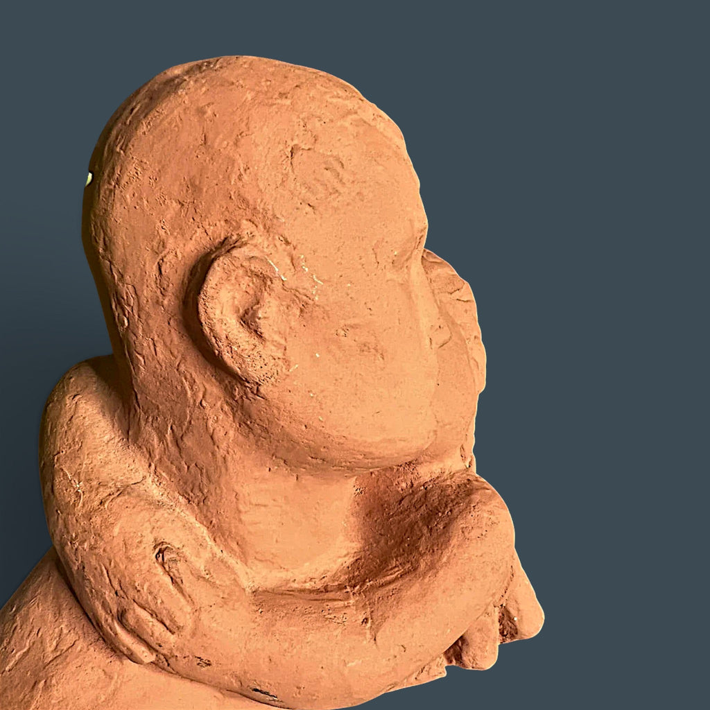 Terracotta clay sculpture depicting two stylized human figures held in a warm close embrace with a hand-modeled rough tactile surface. - Photo 4