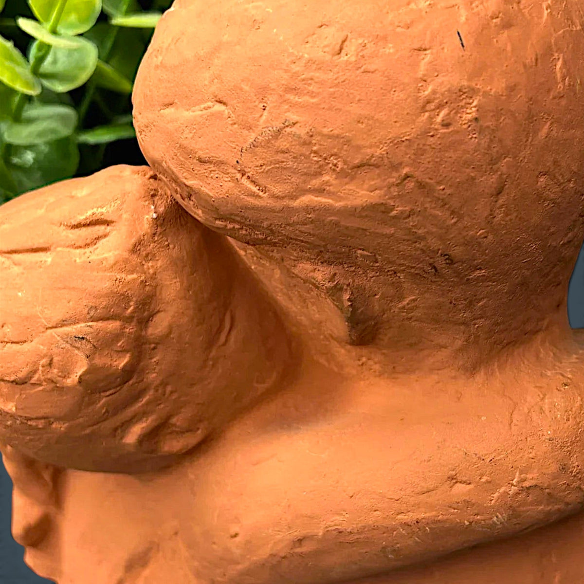 Terracotta clay sculpture depicting two stylized human figures held in a warm close embrace with a hand-modeled rough tactile surface. - Photo 8