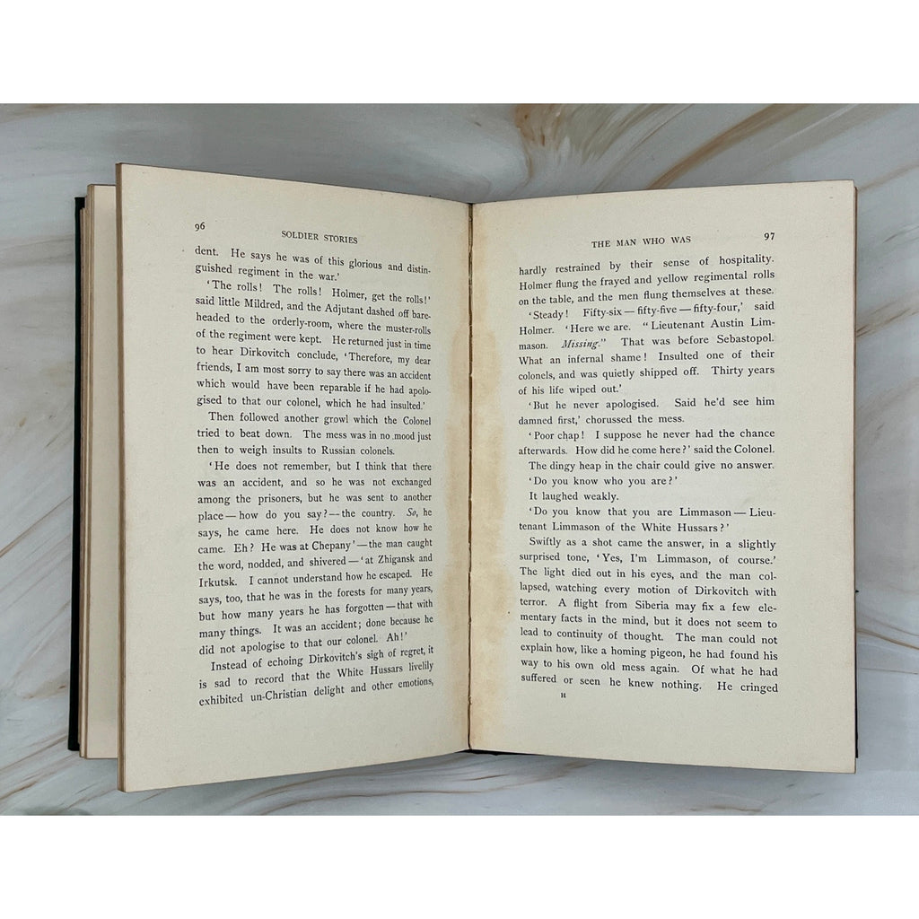 Antique 1897 Rudyard Kipling Soldier Stories hardcover with gilt-stamped soldiers and exotic wildlife on cover.